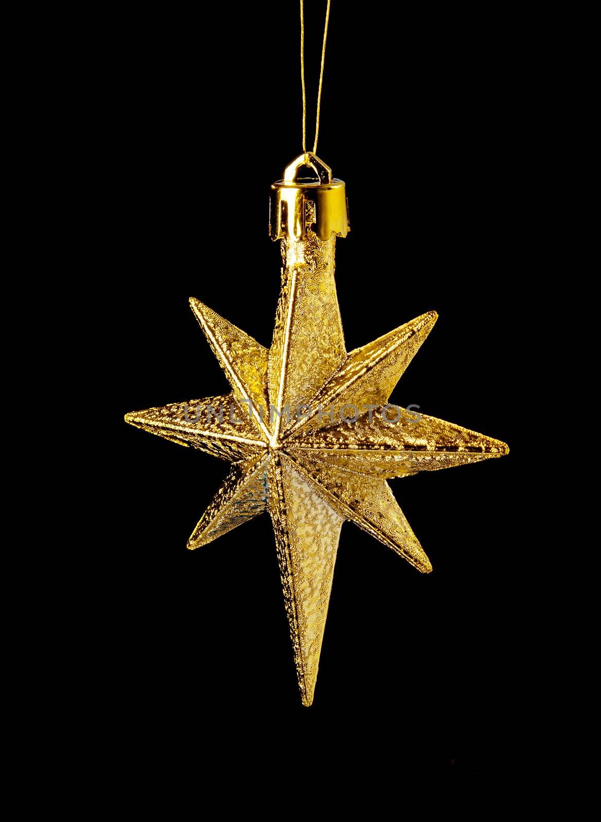 gold(en) star on black background,,christmas ornament