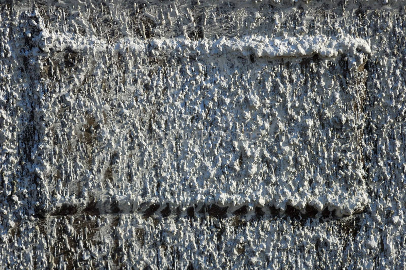 Close up of a sign on the side of a truck, completely hidden beneath splattered paint. Suitable as textured background with space for copy. 