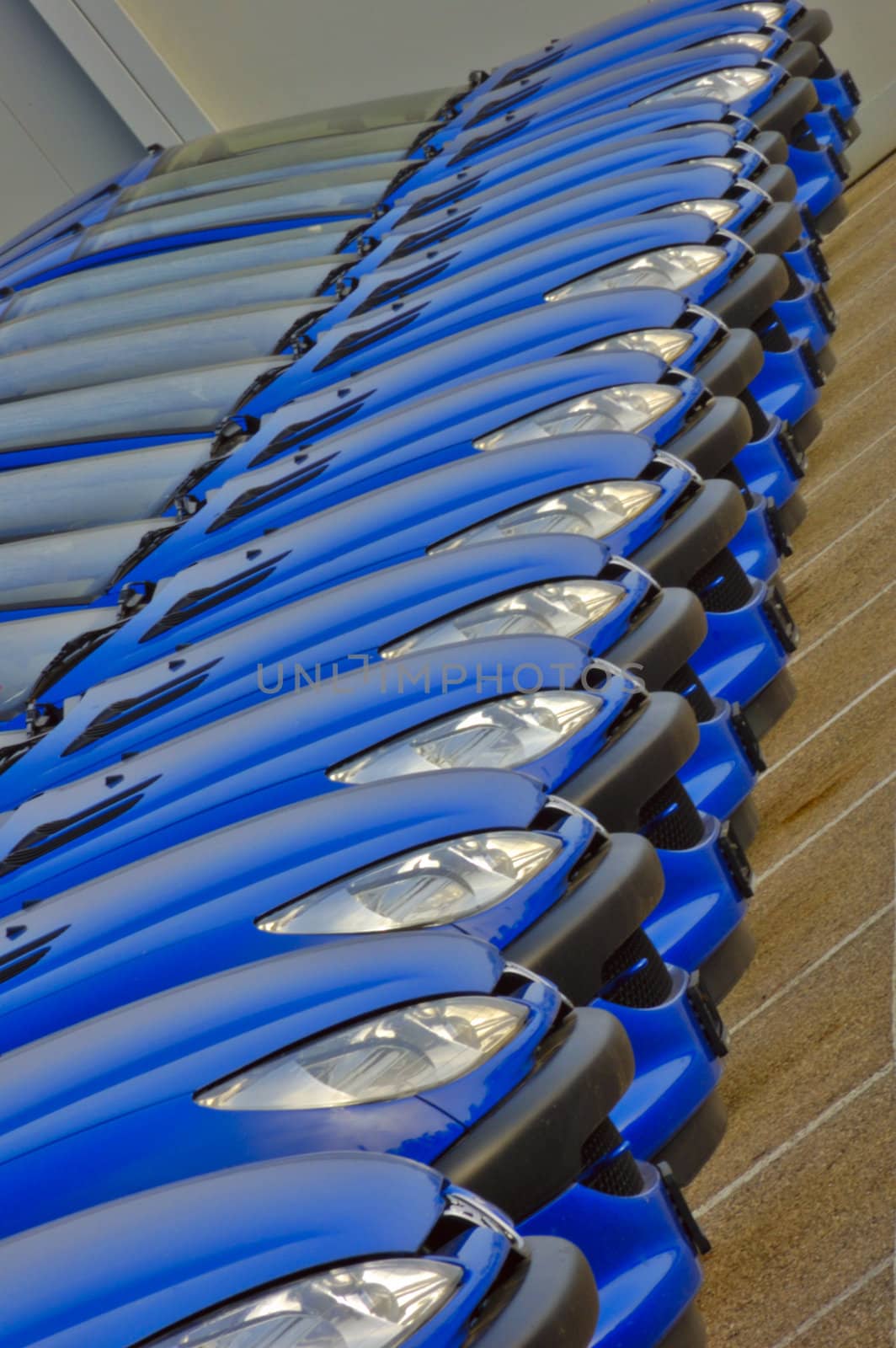 A line of cars parked side by side