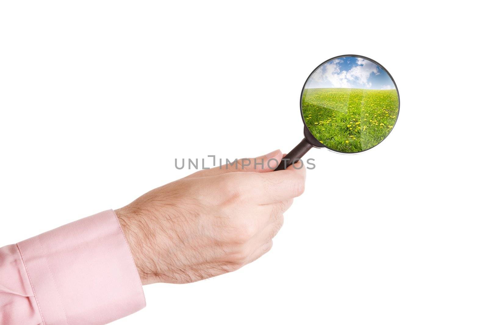 hand of man with loupe isolated on white background and summer landscape( from my image)
