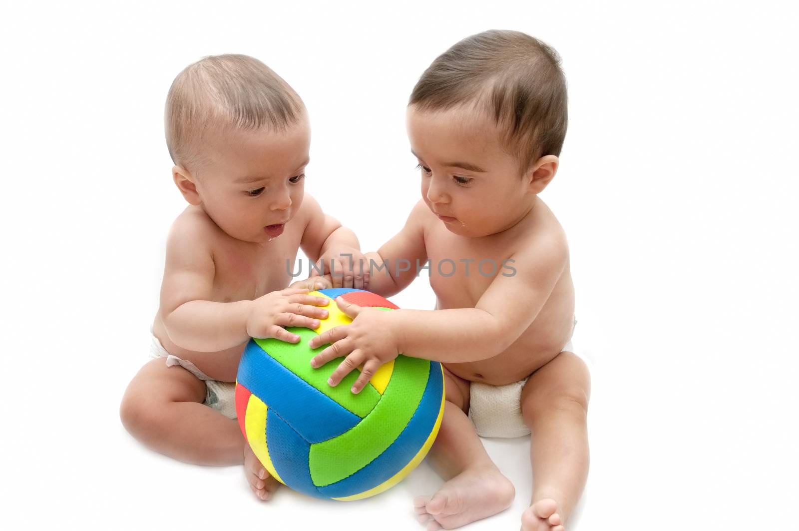 beautiful baby playing with a ball isolated on white background
