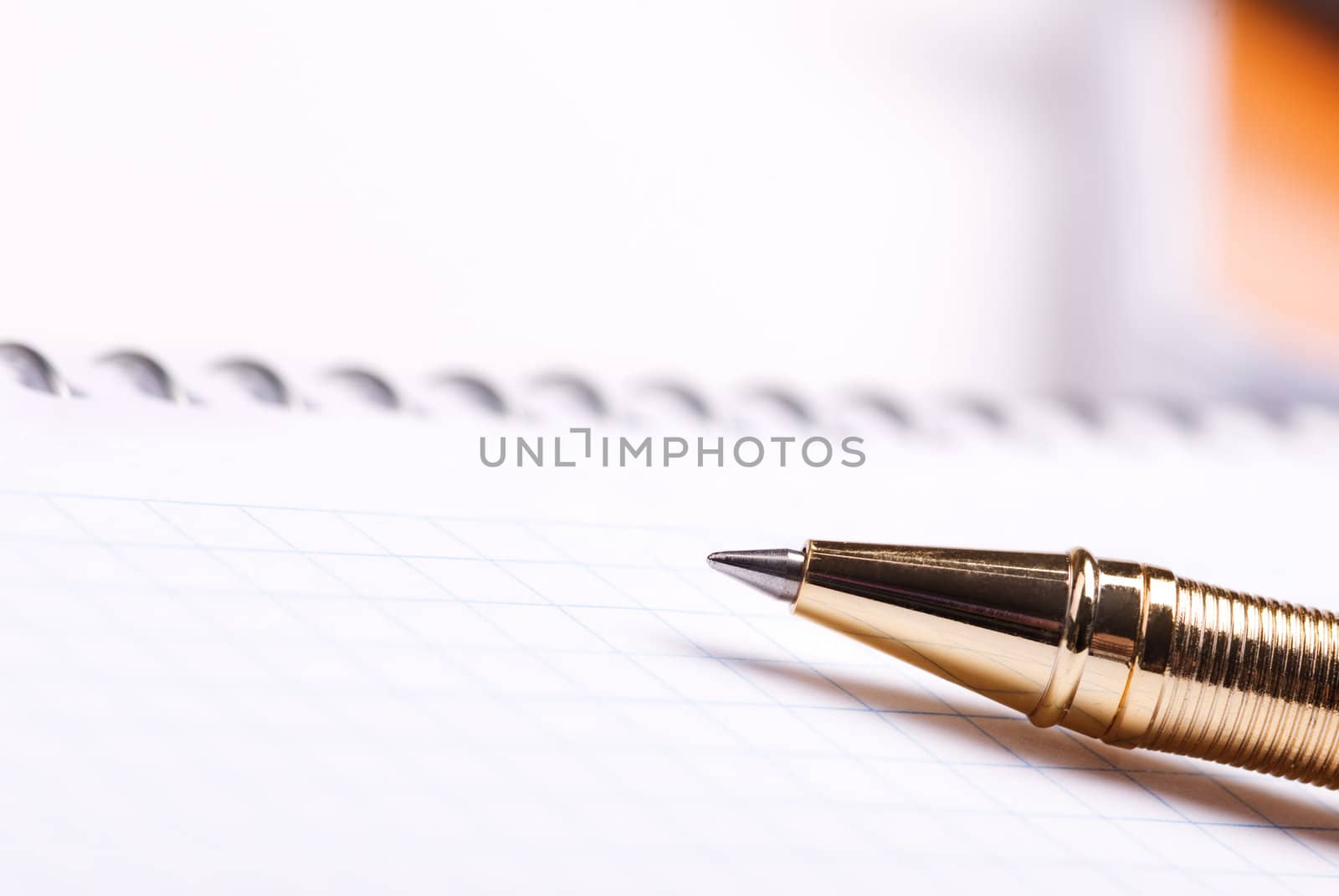 selective focus on nearest part of golden pen