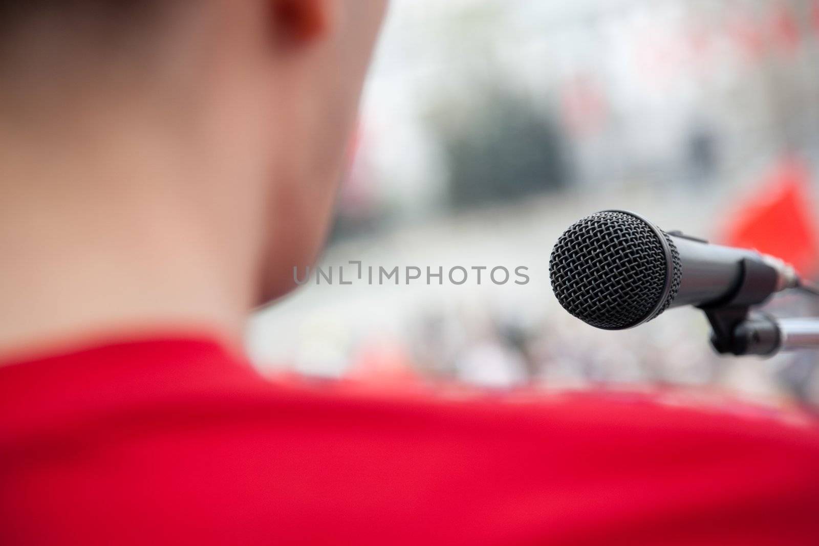 political concept, focus point on black mic and lens blur f/x