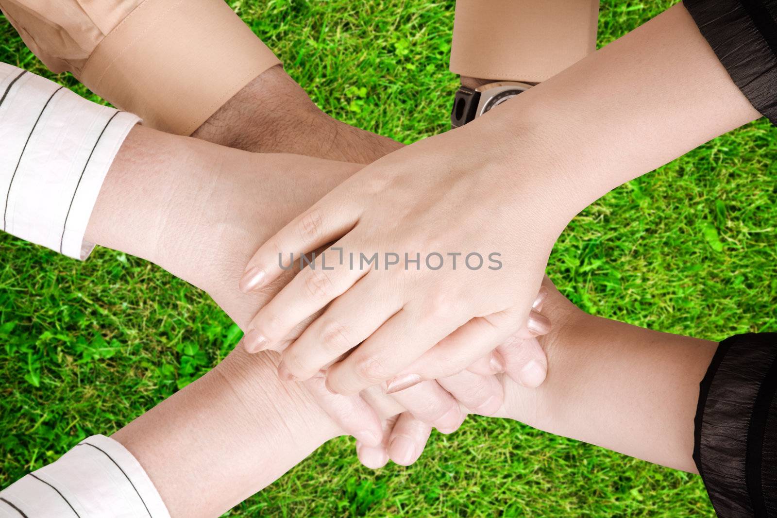 connecting people on green grass background, focus point on center