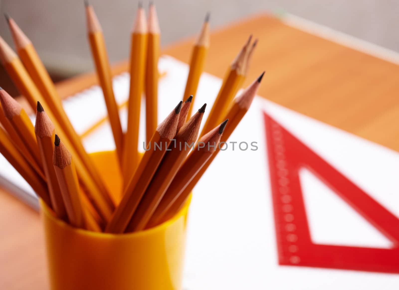 selective focus on nearest parts of some yellow pencil