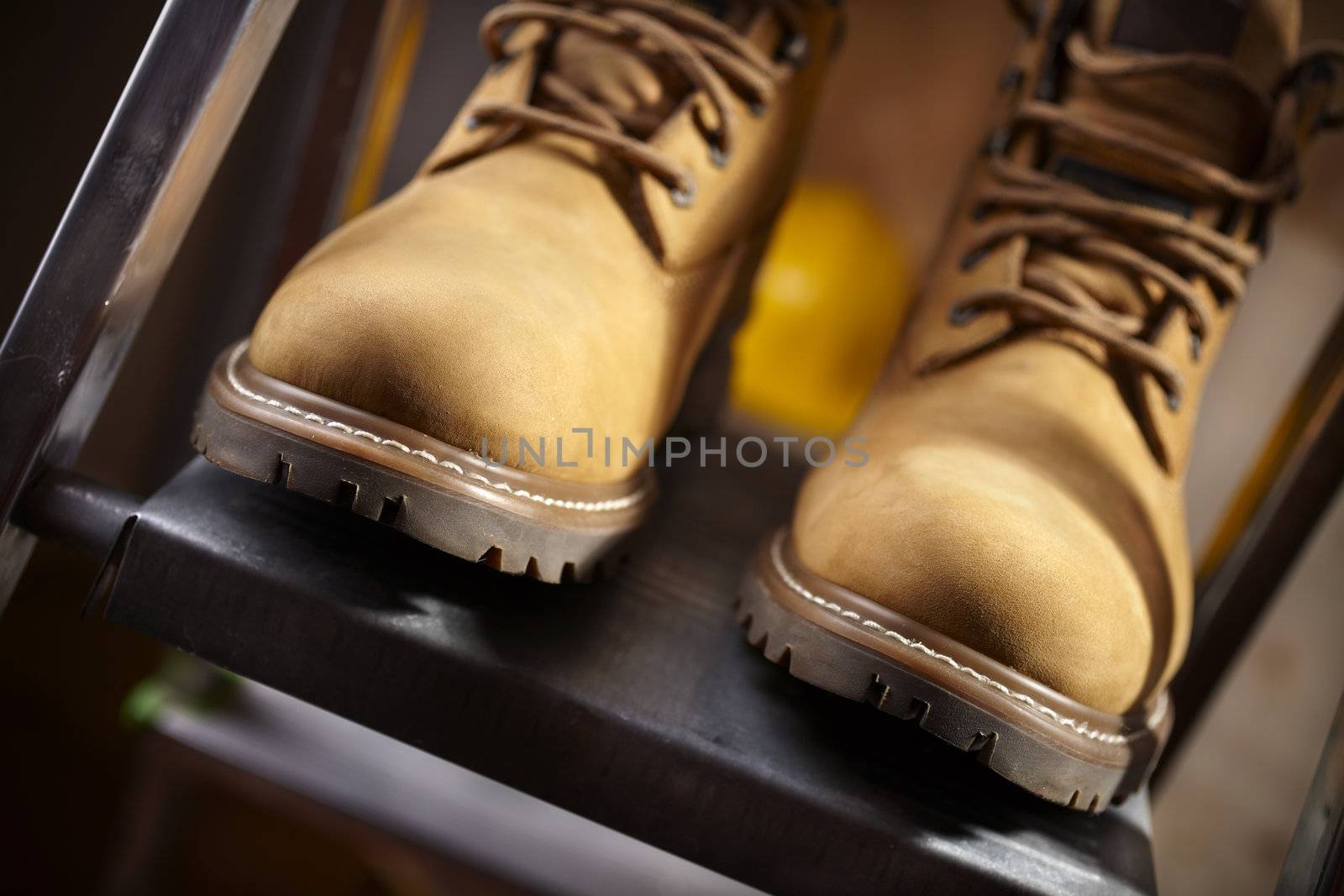 shoes on metal stepladder,selective focus on nearest part