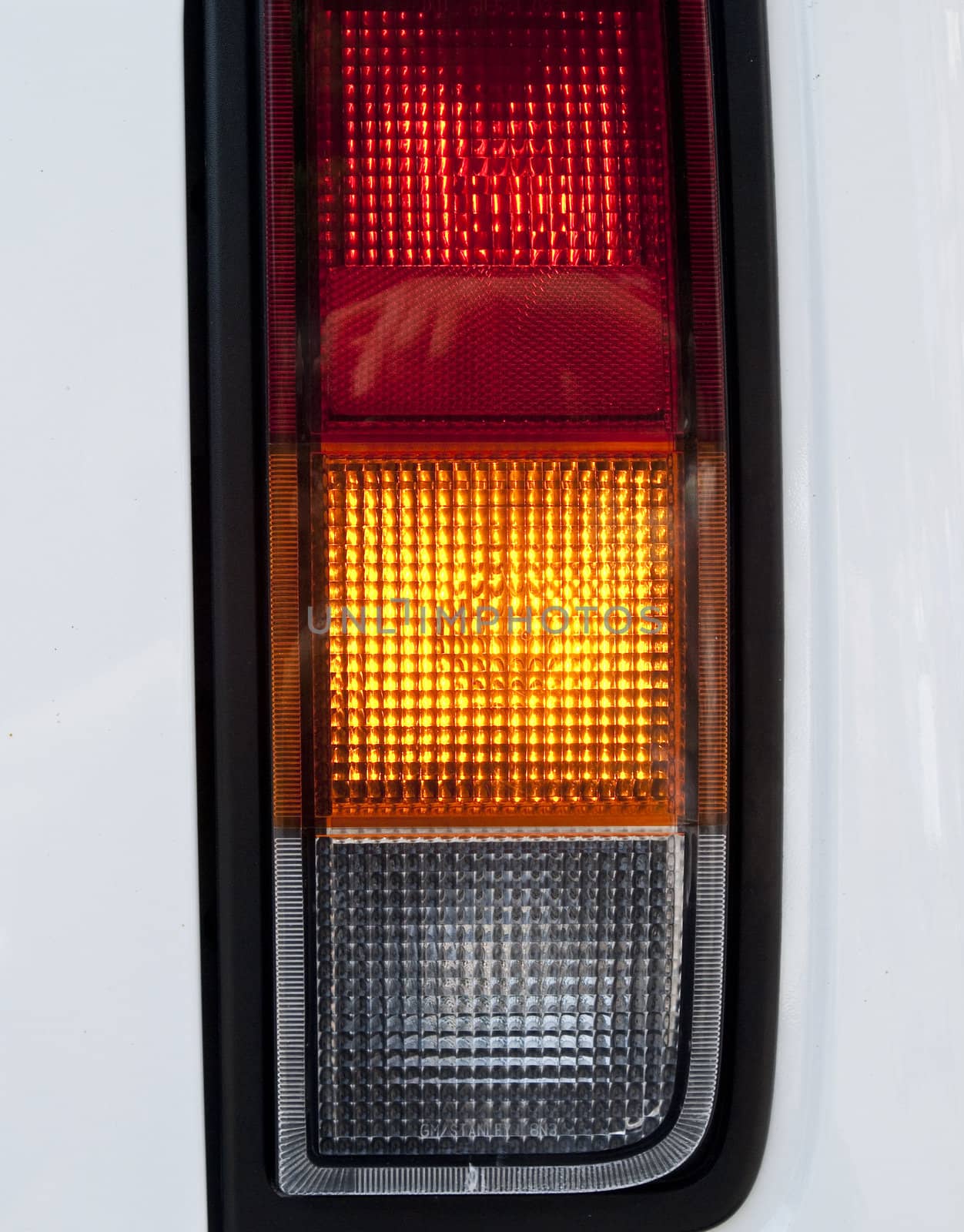 Modern car headlight - red, yellow, green
