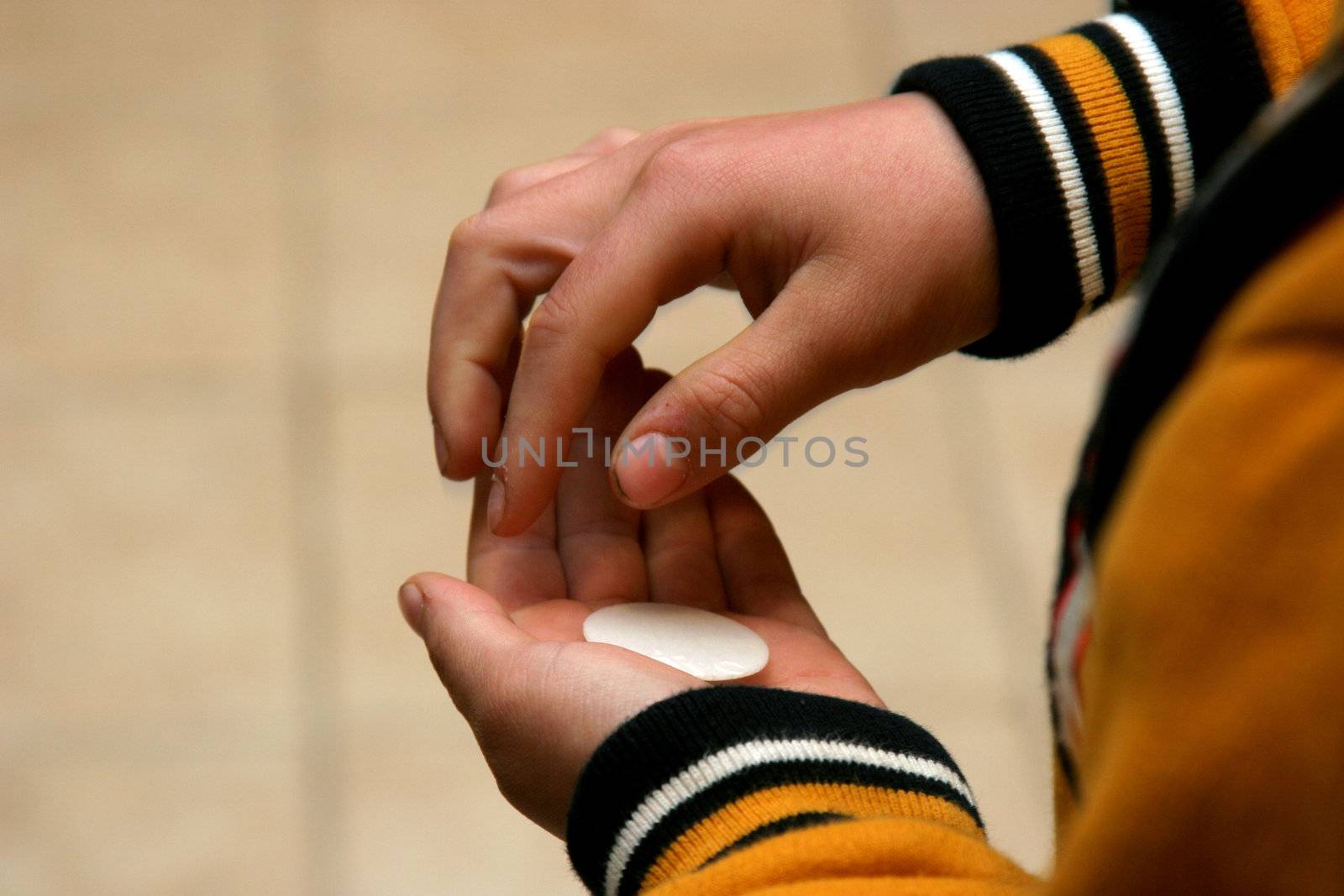 Boy holding a communion bead