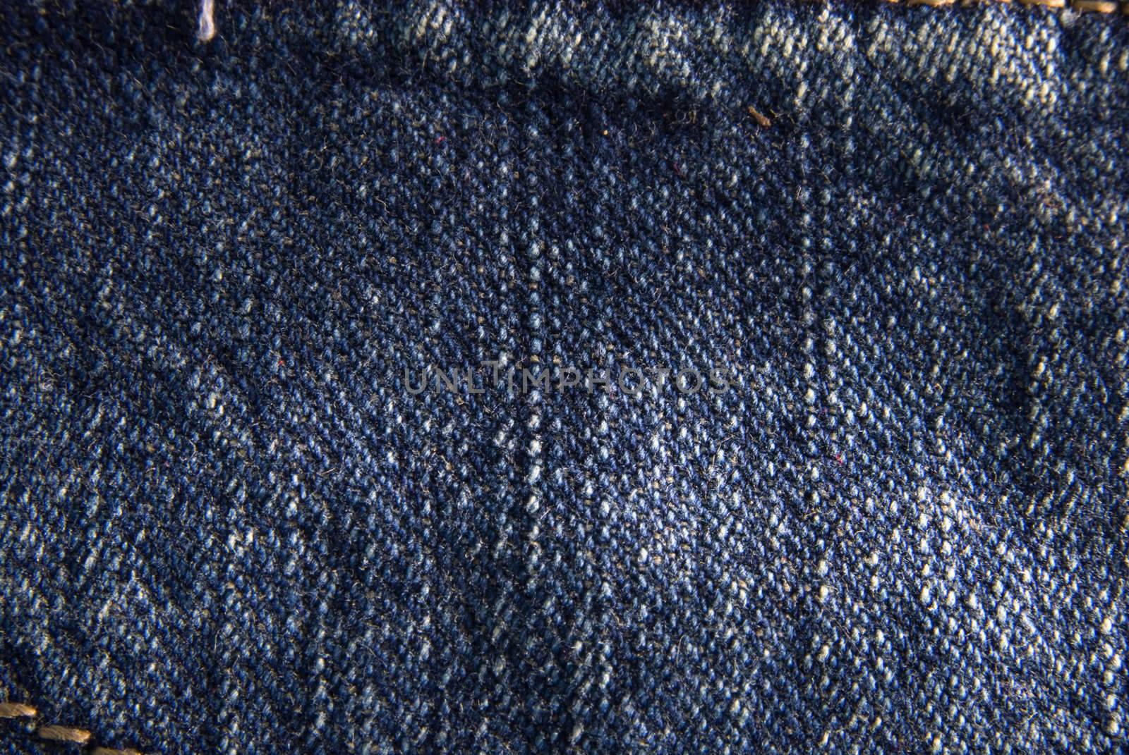 Blue denim jeans texture macro close up. Useful as background for design works.