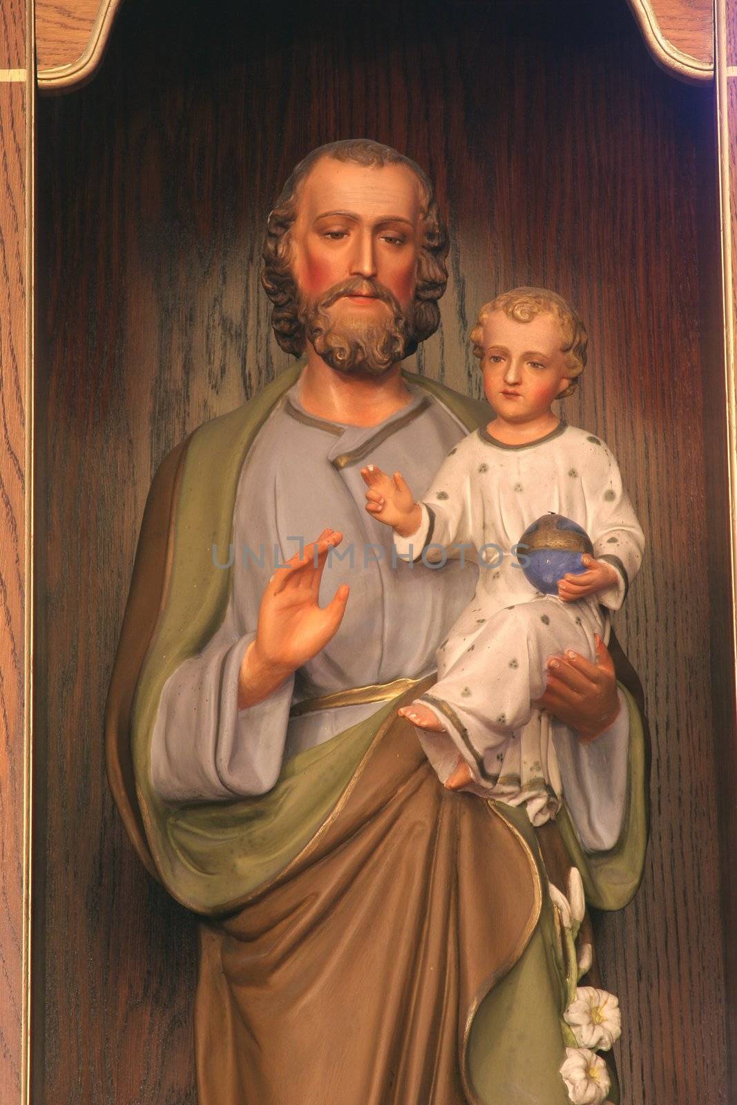 Saint Joseph holding baby Jesus
