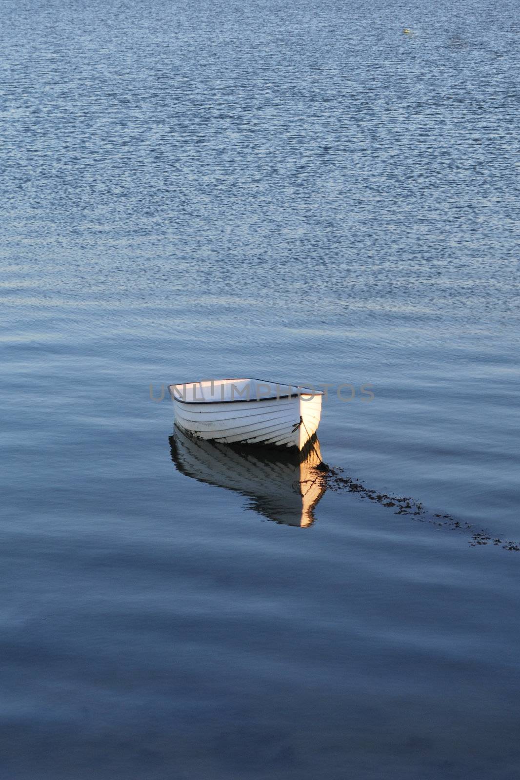 Lonely white rowing boat
