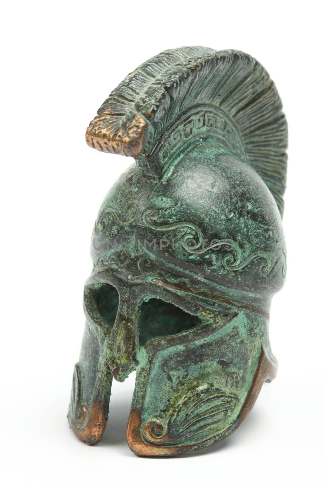 Souvenir ancient bronze greek helmet over white 