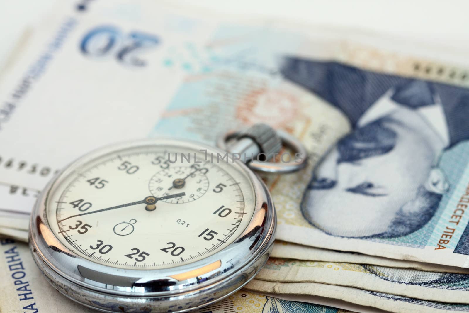 Chronometer and Bulgarian currency close up, shallow dof