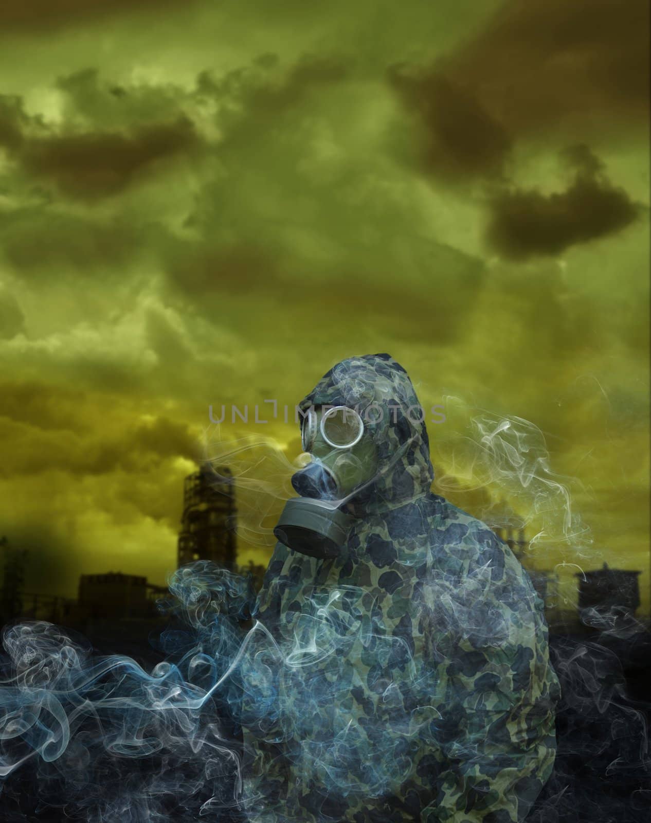 the man in anti-gas mask on a factory background