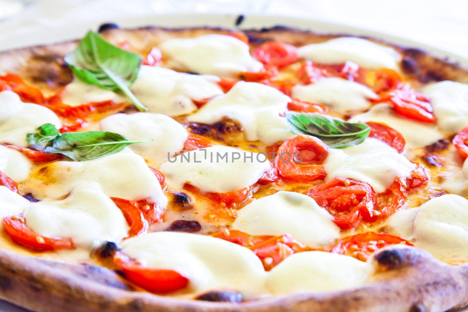 This is a true Italian Pizza. Traditional Pizza Margherita served in a Capri's restaurant, Naples Gulf, Italy.