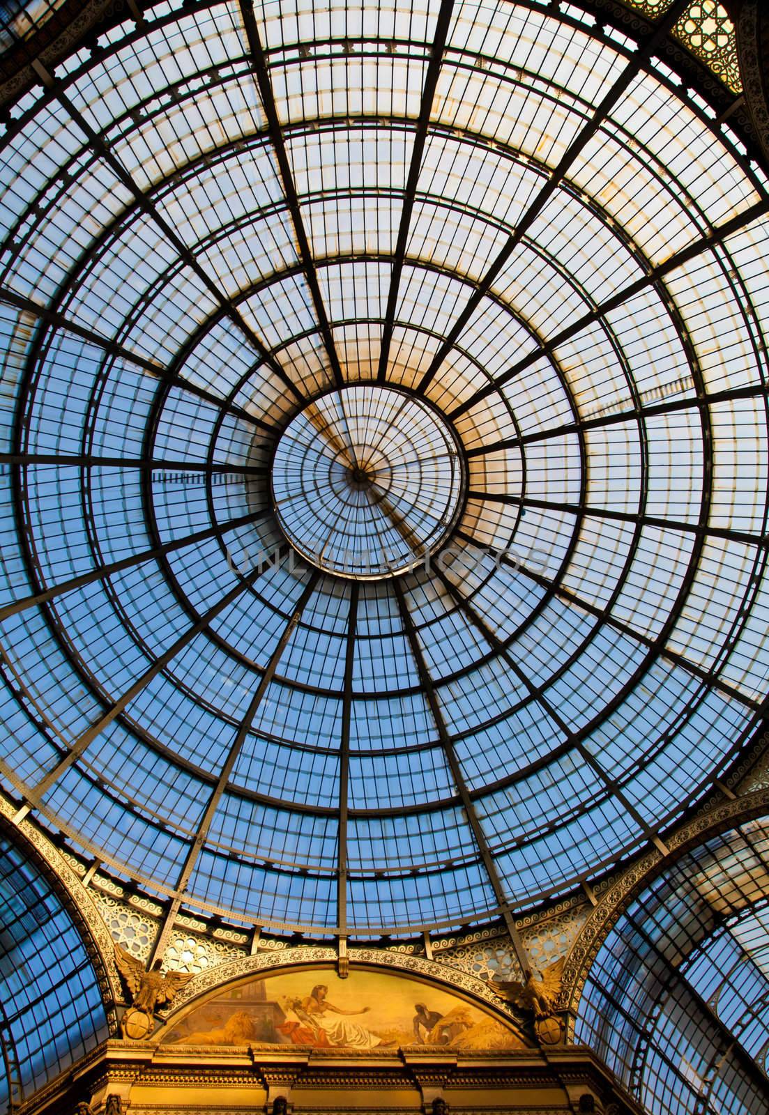 The Galleria Vittorio Emanuele II is a covered double arcade formed of two glass-vaulted arcades at right angles intersecting in an octagon, prominently sited on the northern side of the Piazza del Duomo in Milan.