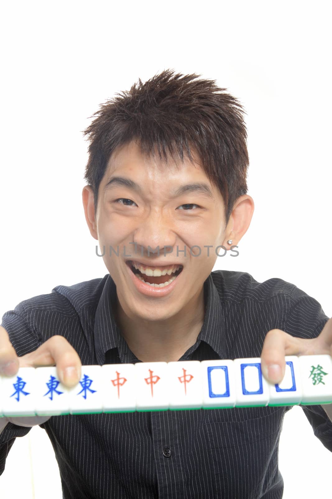 Chinese man play Mahjong, traditional China gamble.  by cozyta