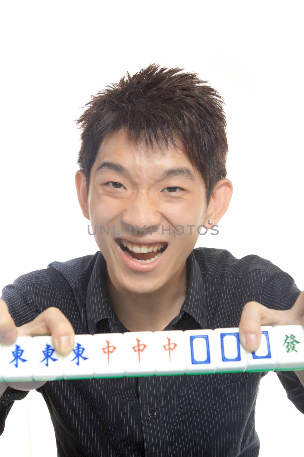 Chinese man play Mahjong, traditional China gamble. 