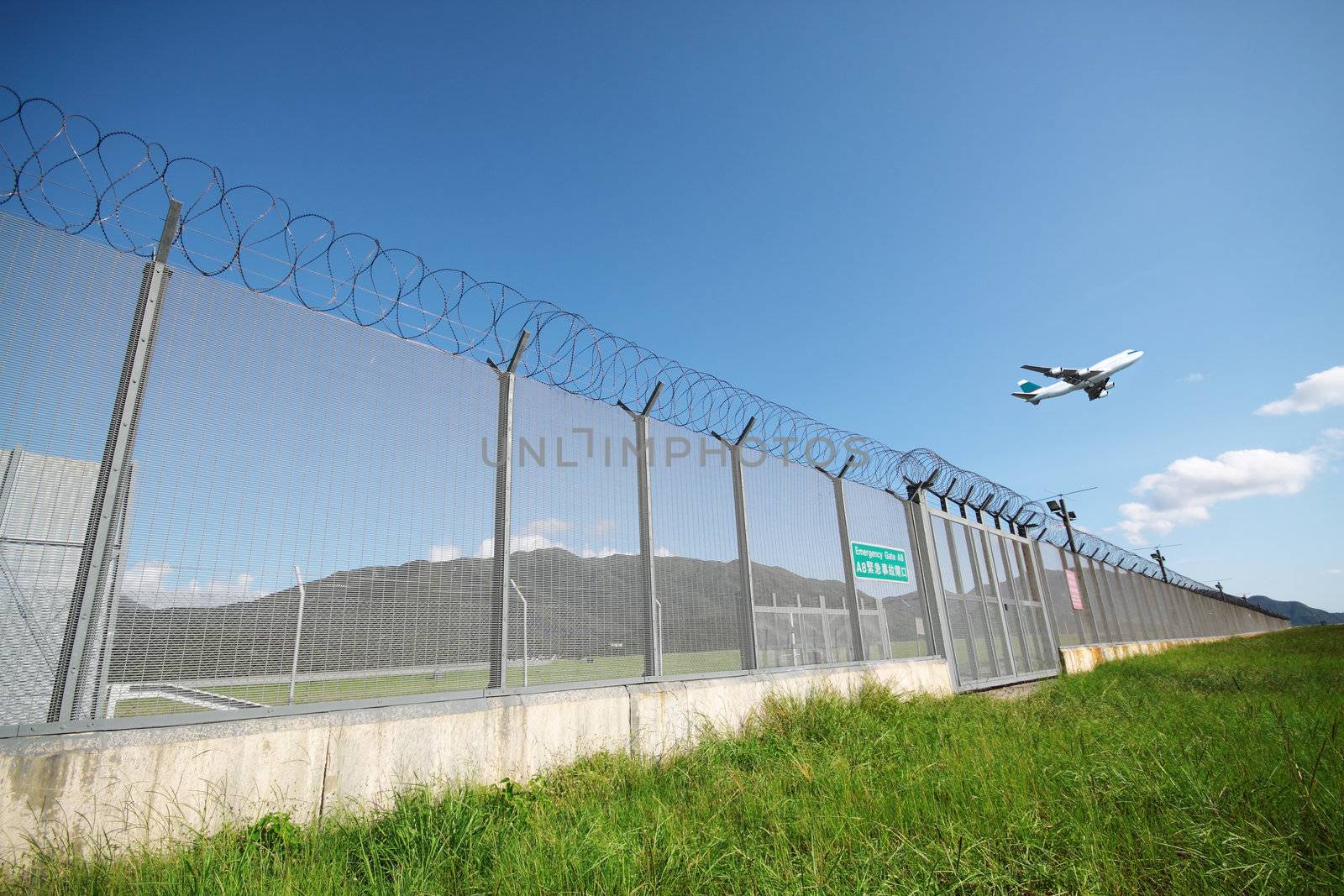 Airplane flying in green airport