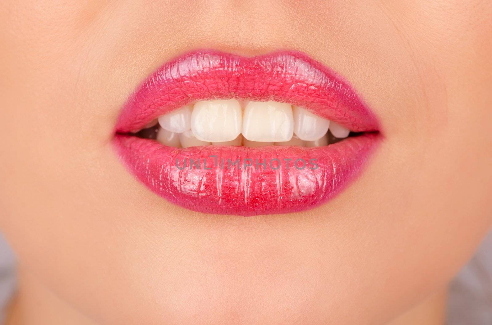 Close up of a young woman's glossy lips
