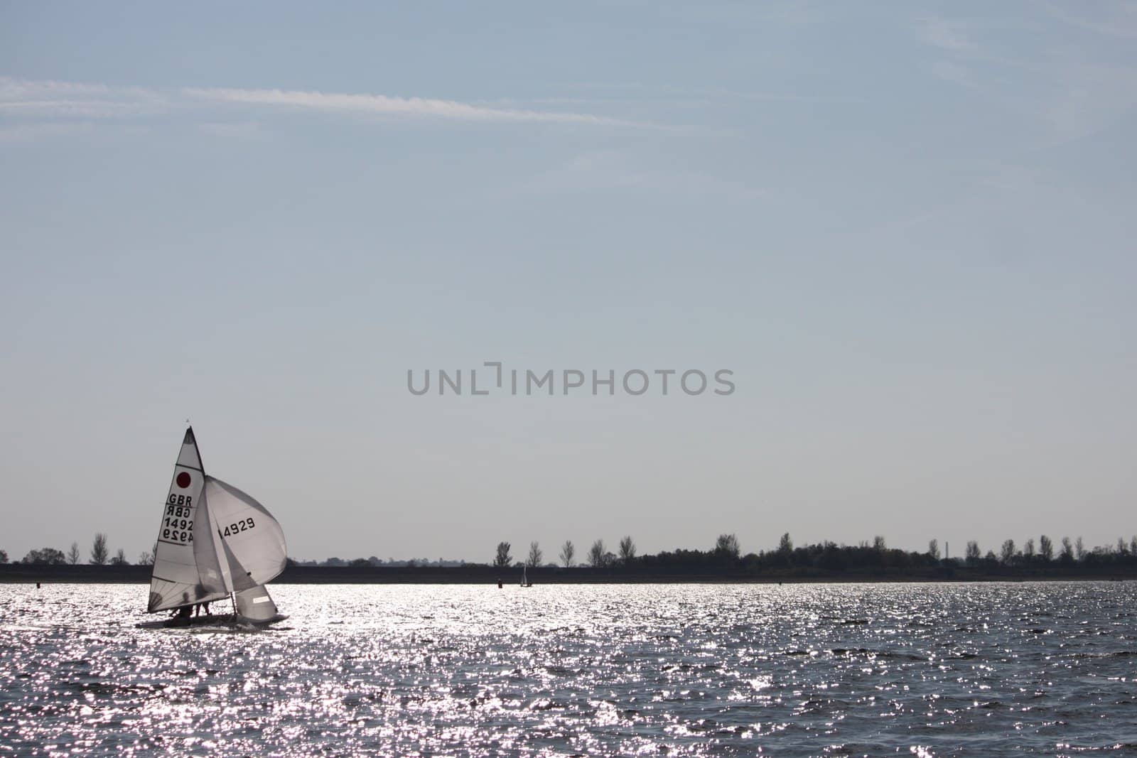 Sailing Boat on a lake under a blue sky