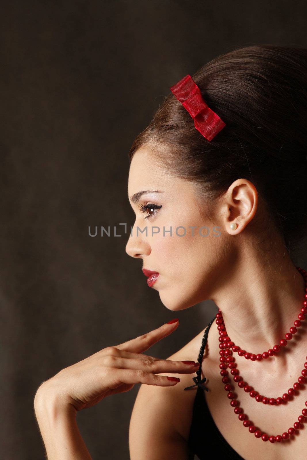 Portrait of the beautiful brunette in studio