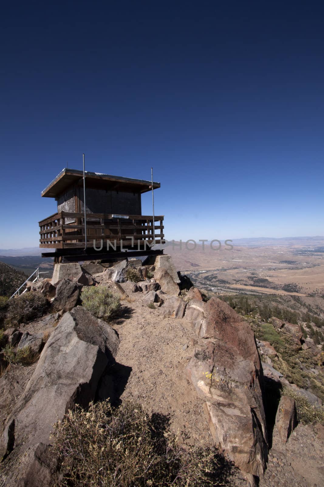 Lookout tower in a mountain range by jeremywhat