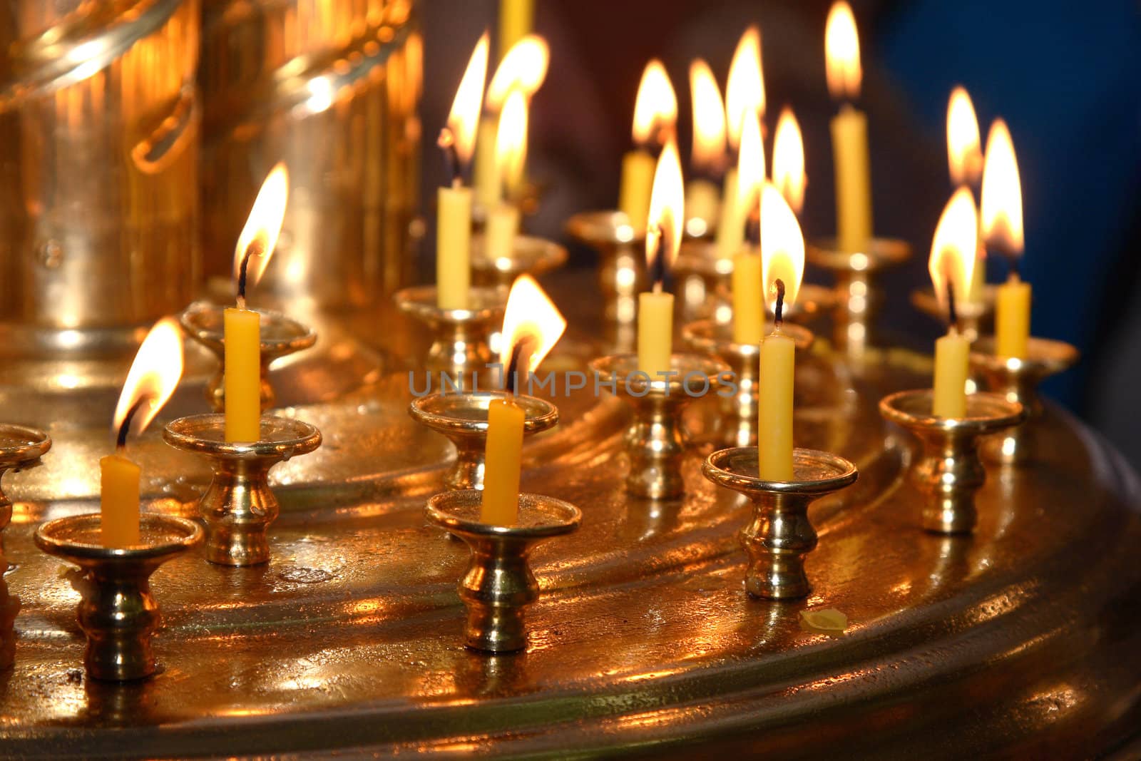 Church wax candles on a candlestick