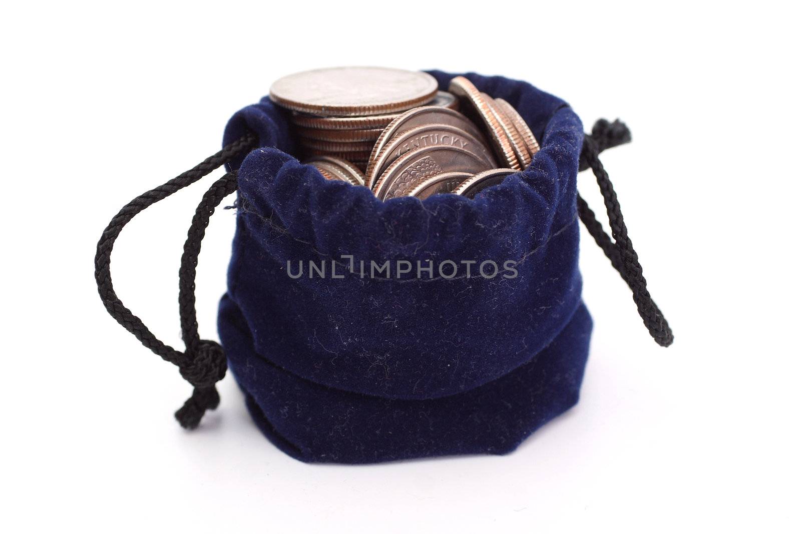 Coins in blue bag isolated on white
