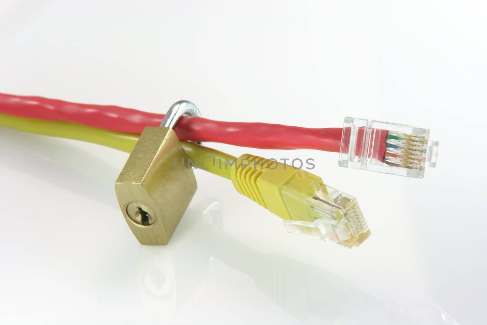 computer and connections safe data transfer concept with two ethenet cables red and yellow and a locked padlock isolated on white with reflection