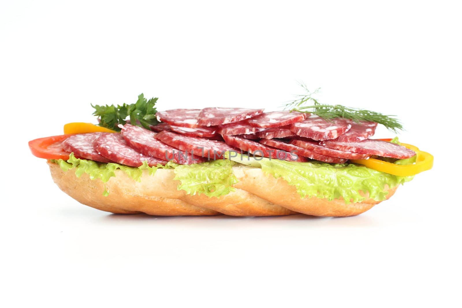 Sandwich with sausage, pepper, a tomato