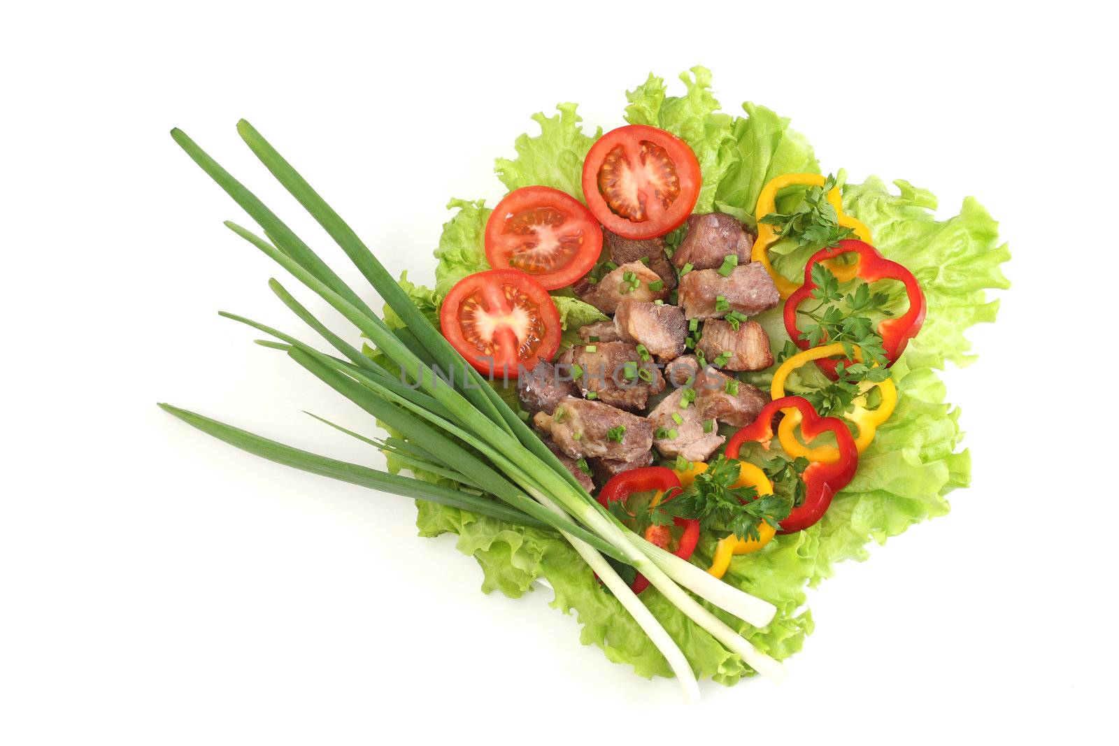 Appetizing shish kebab with tomatoes and greens