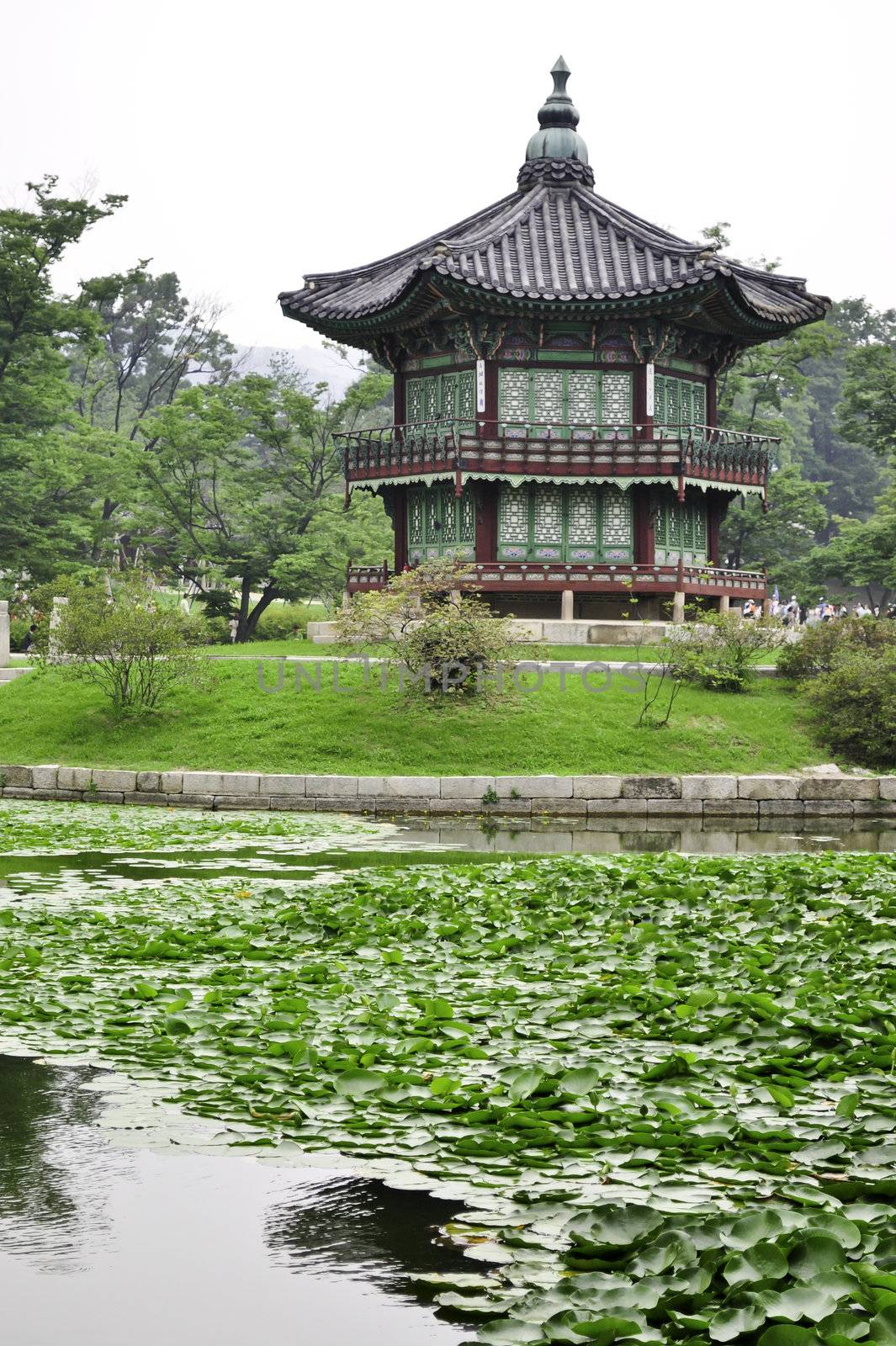 A garden pond with a Chinese style pagoda in the city of Seoul, Korea