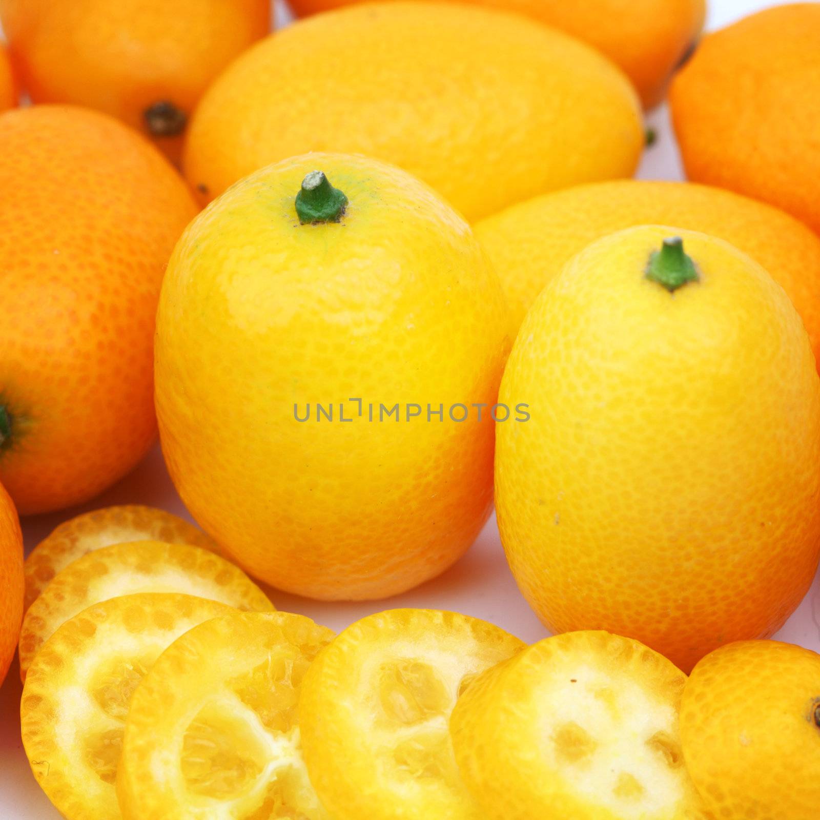 kumquat close up isolated on white