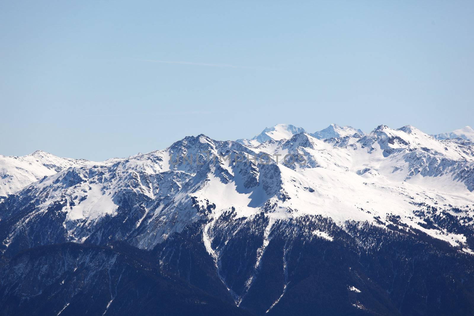 top of mountains sun in blue sky
