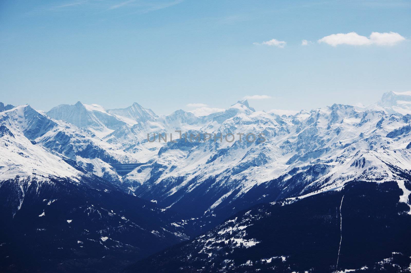 top of mountains in blue sky