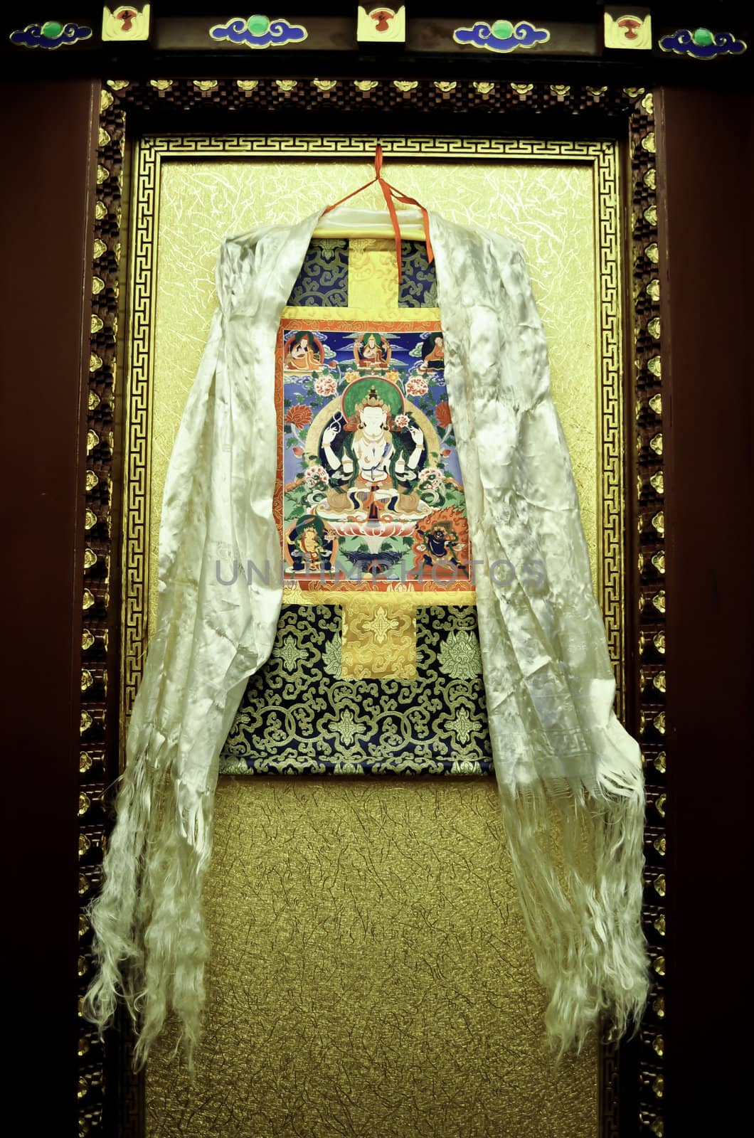a tibetan silk scarf and wall hanging in a hotel