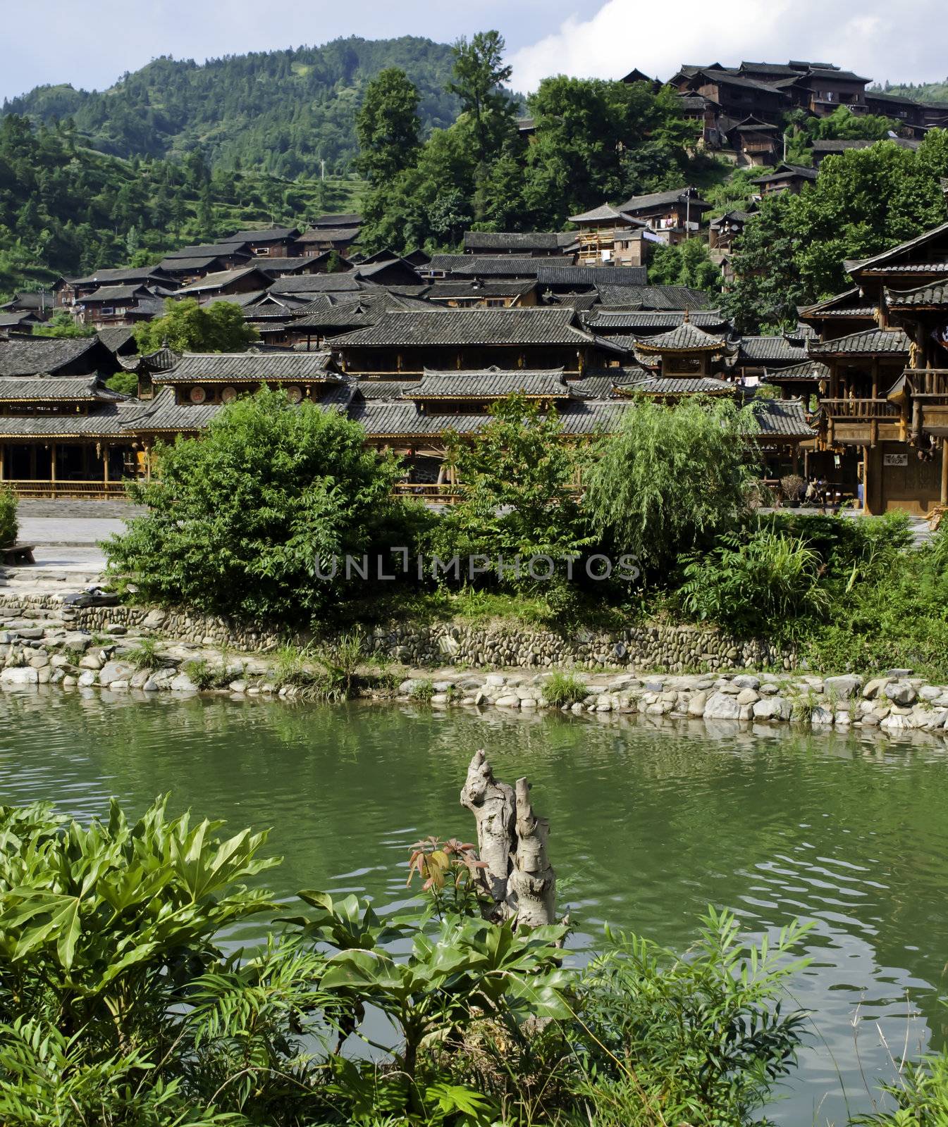 Ethnic Chinese Miao village near a river in rural China