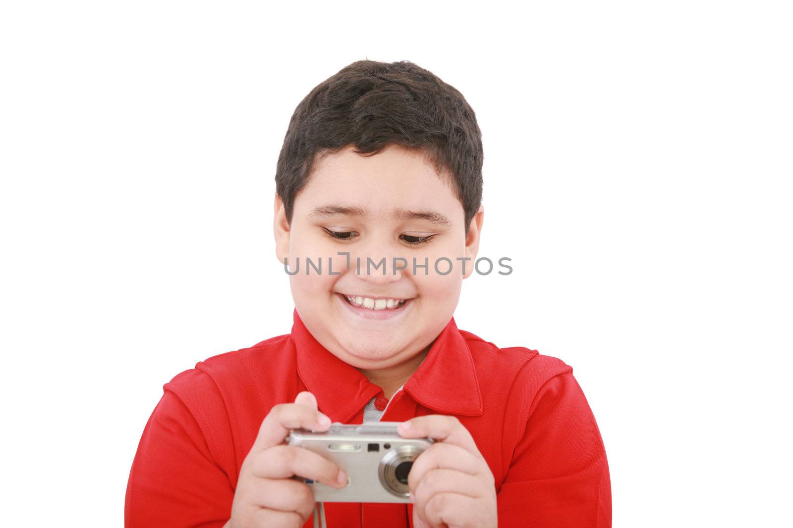 small boy with digital camera on white background