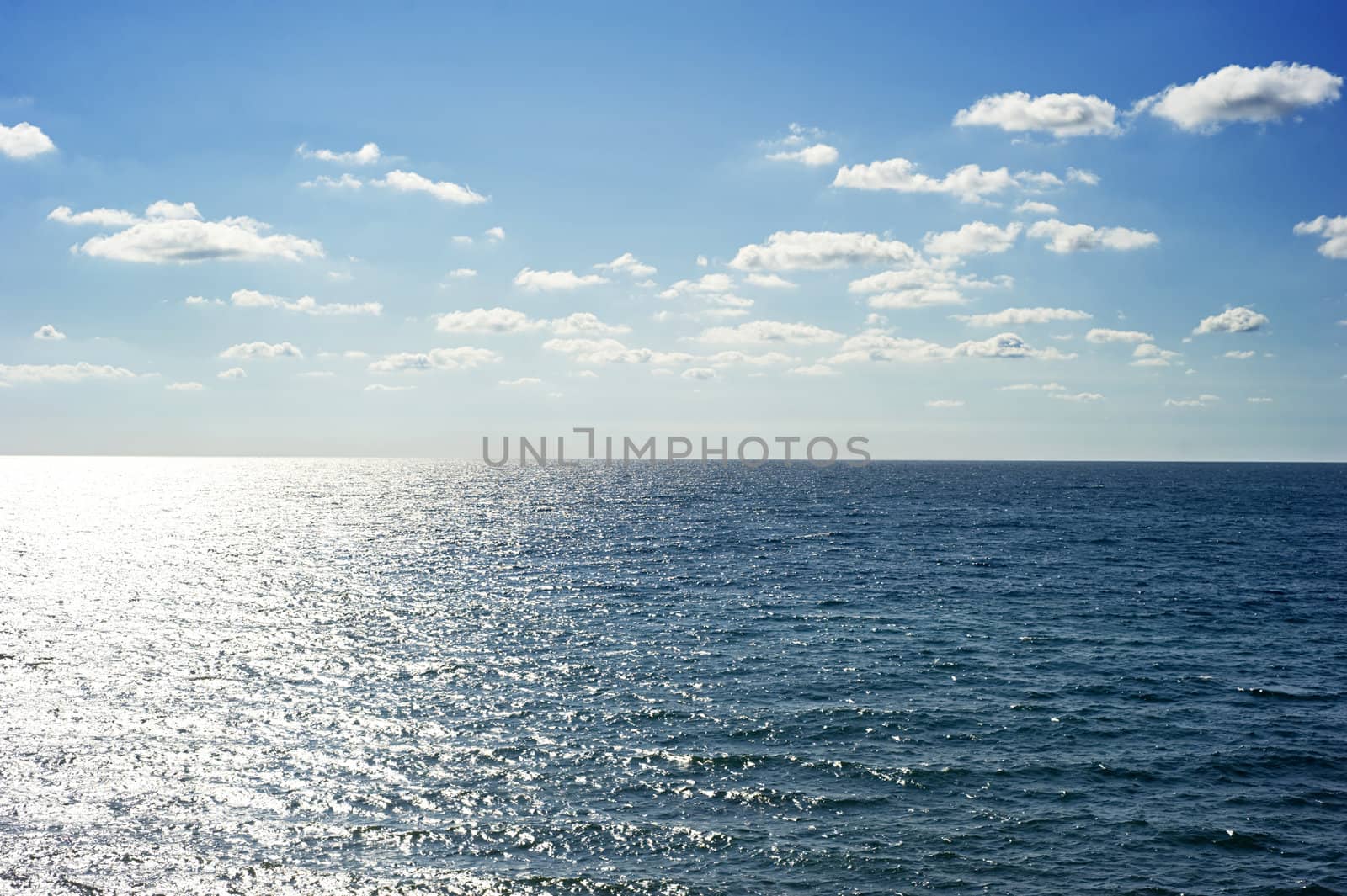 Clouds over the sea in the sunshine day