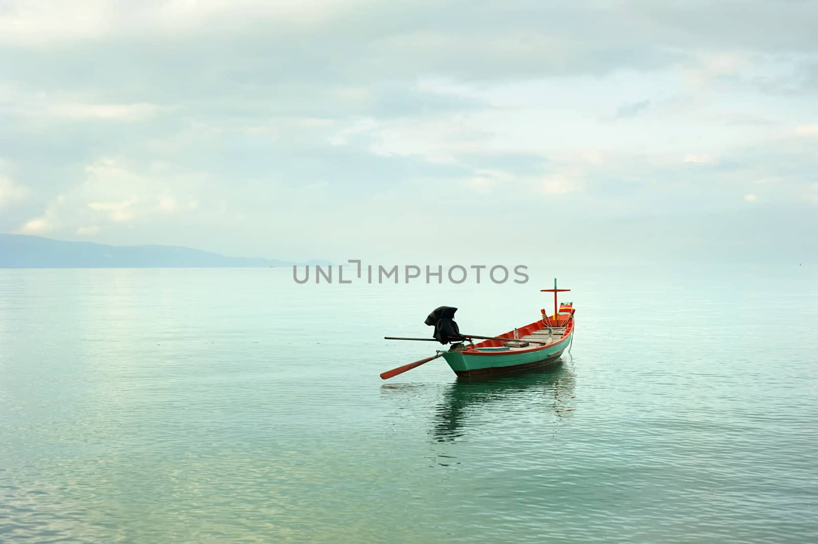 Traditional thailand boat  in the sea at sunrise