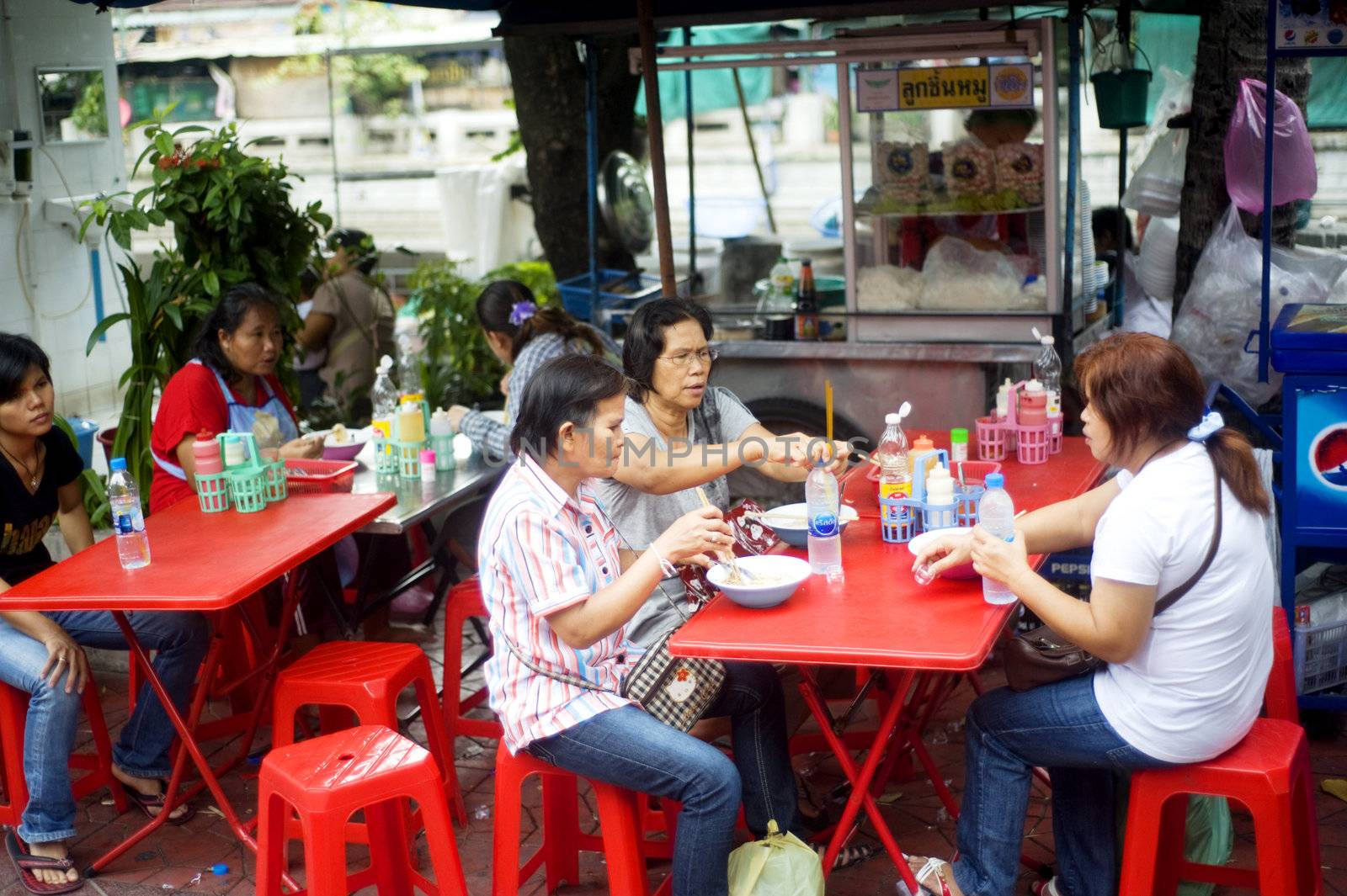 Bangkok, Thailand - March 27, 2011: Traditional thai fast food on Bangkok street