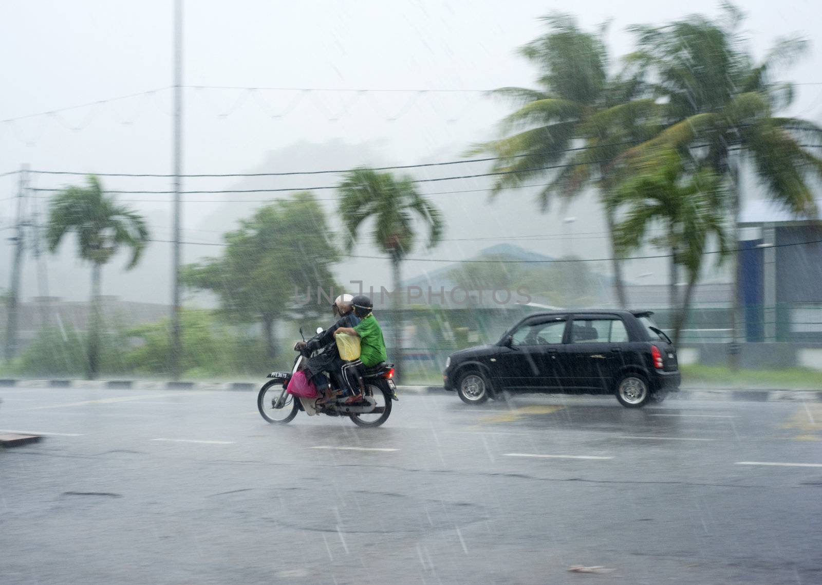 Kedah, Malaysia - March 28, 2011: Traffic in the heavy rainfall in Malaysia