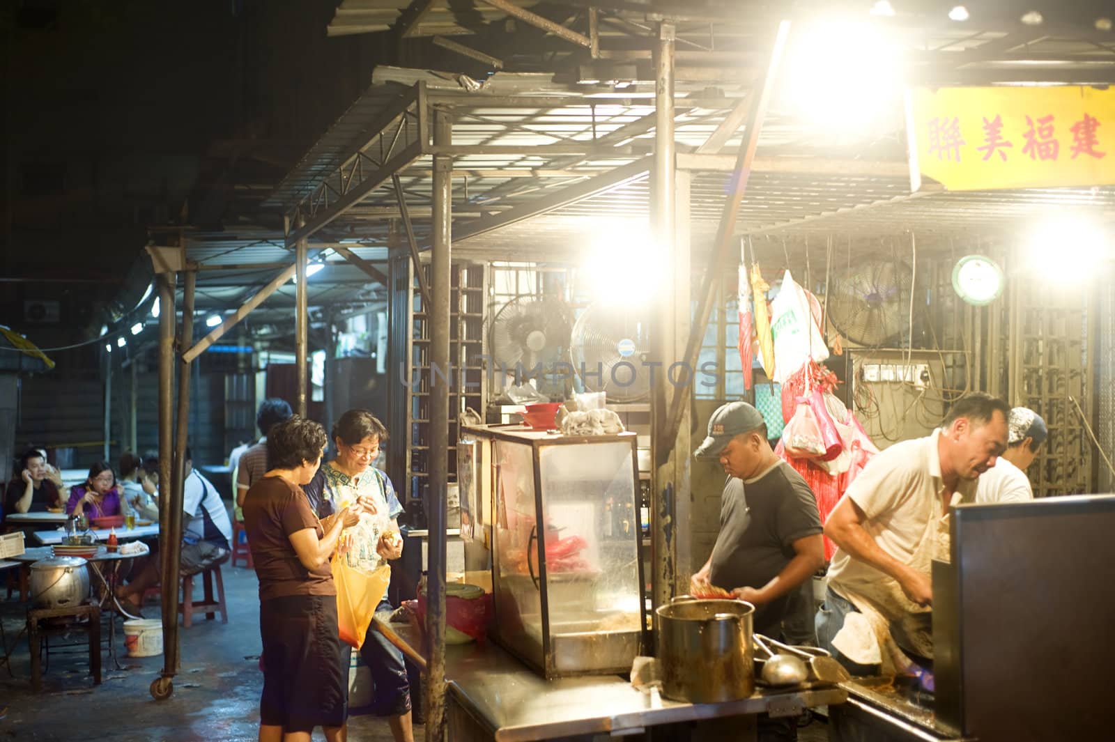 Kuala Lumpur, Malaysia - March 30, 2011: Street fast food in Kuala Lumpur's China Town at night.