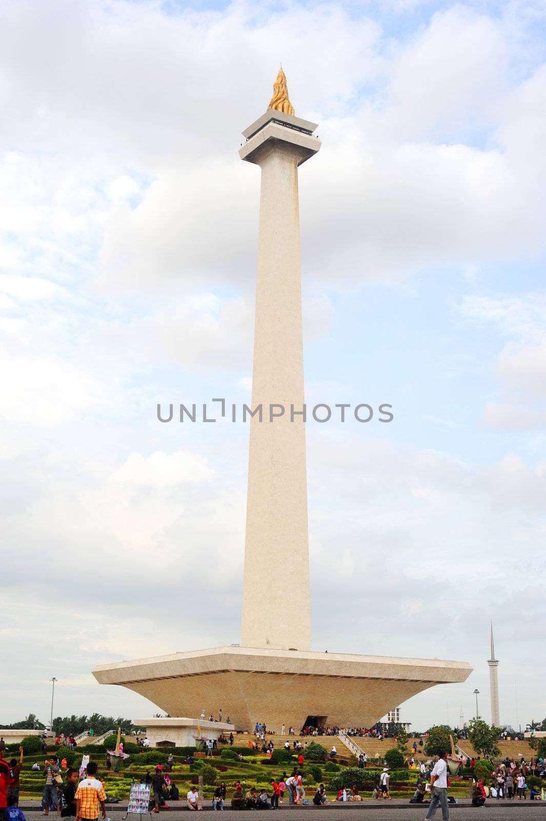 Jakarta,Indonesia - March 3, 2011: people at  National Monument l (Monas) is a 433 ft (132 meter) tower in the center of Merdeka Square, Central Jakarta, symbolizing the fight for Indonesia's independence