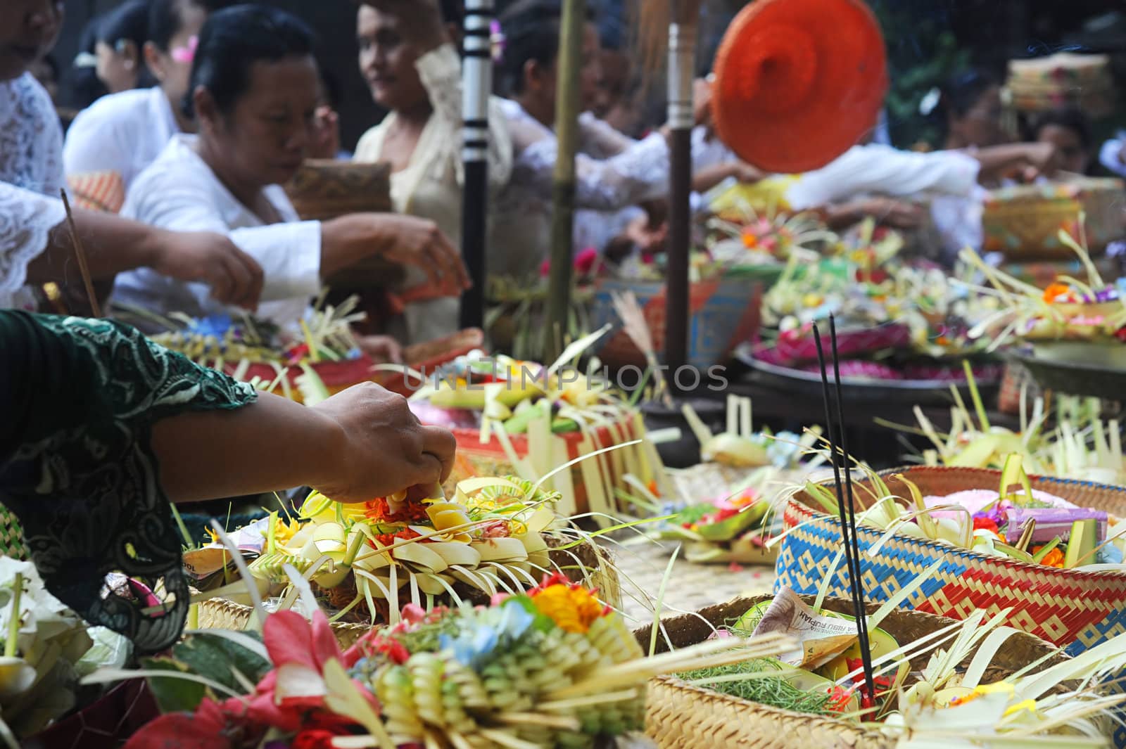 Ubud, Bali island, Indonesia - April, 06, 2011: Unidentified local people wearing in traditional indonesian clothes take part in Buda Wage Kelawu ceremony at Hindu temple.