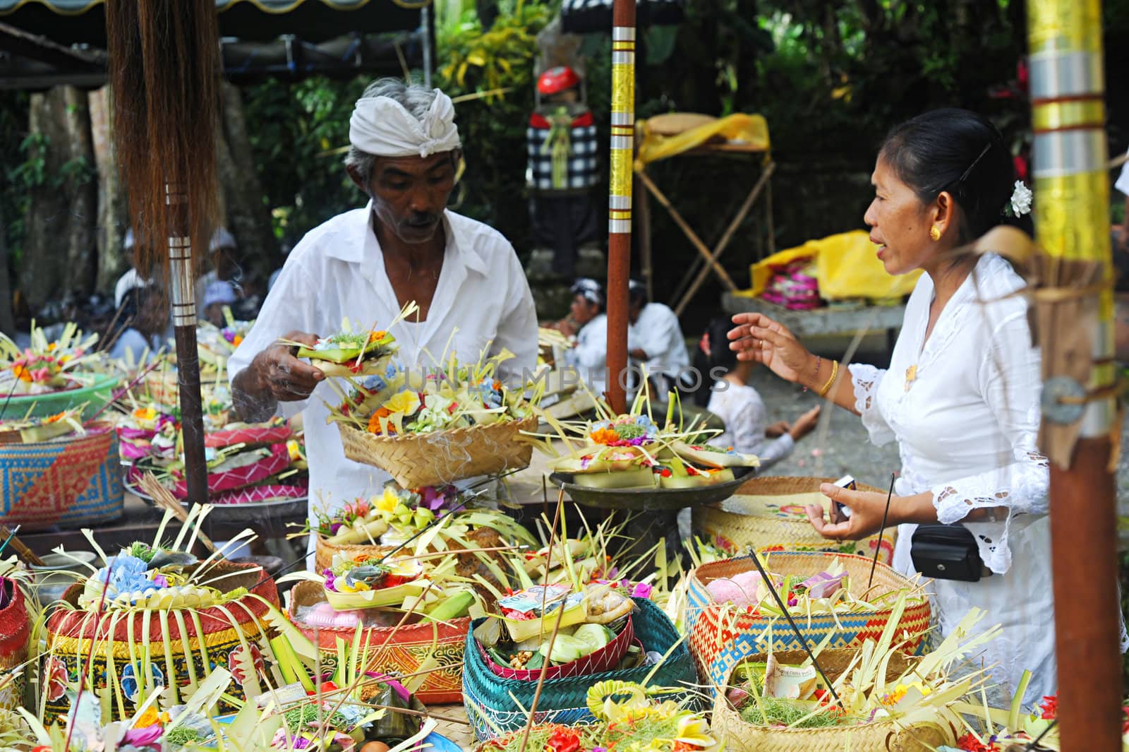 Ubud, Bali island, Indonesia - April, 06, 2011: Unidentified local people wearing in traditional indonesian clothes take part in Buda Wage Kelawu ceremony at Hindu temple.