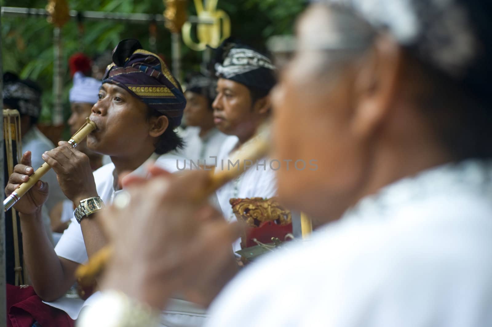 Ubud, Bali island, Indonesia - April, 06, 2011: Unidentified musician wearing in traditional indonesian clothes take part in Buda Wage Kelawu ceremony at Hindu temple.