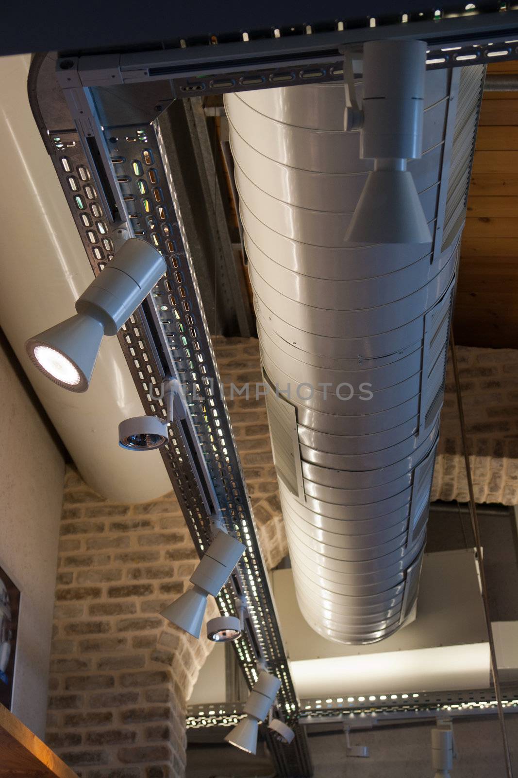 Ventilation system pipes on the ceilling of a modern factory plant building