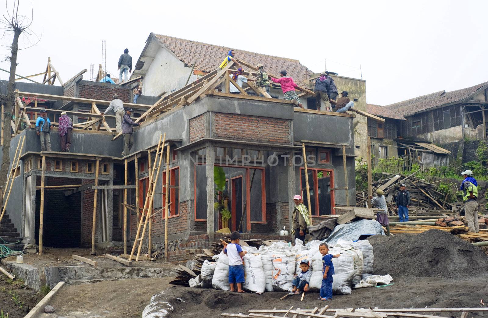 Sukapura, Indonesia - April 23, 2011: Construction activity of a building in small Indonesian village